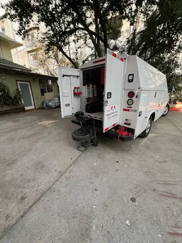 Magnet Plumbing service vehicle on-site for Grease Trap Cleaning in Bayway Isles
